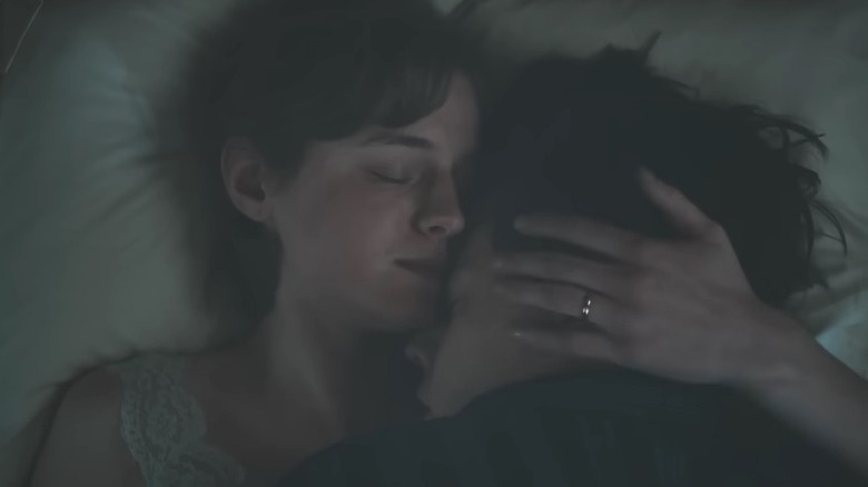 Marion hugging Tom in bed