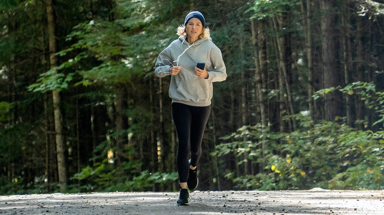 Amy jogging in the woods