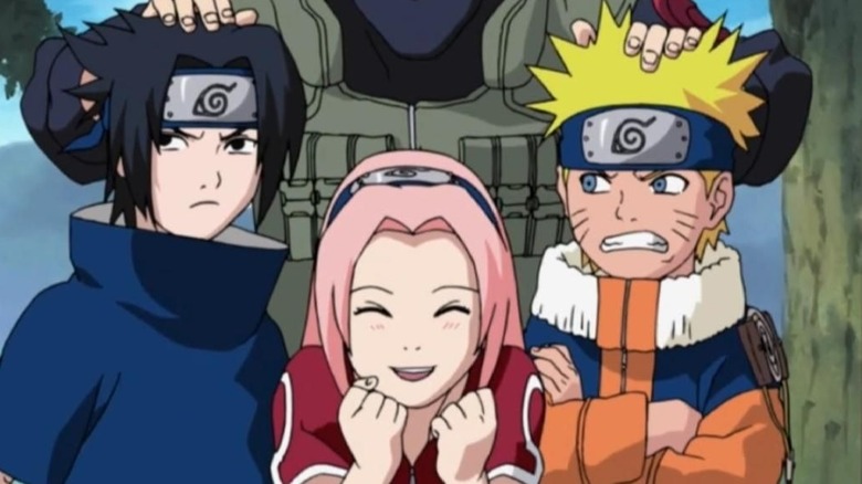 Sasuke, Sakura, and Naruto posing