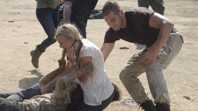 Shane pulling Beth away from walker