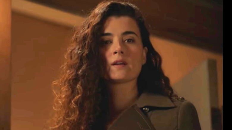 Ziva David in front of door