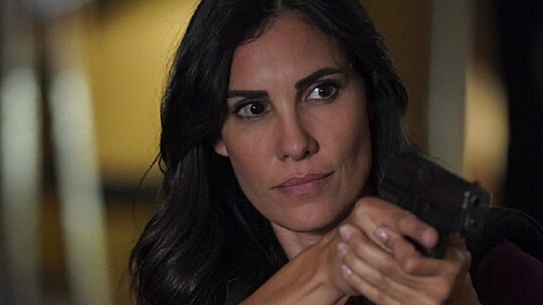 Kensi Blye holding a gun