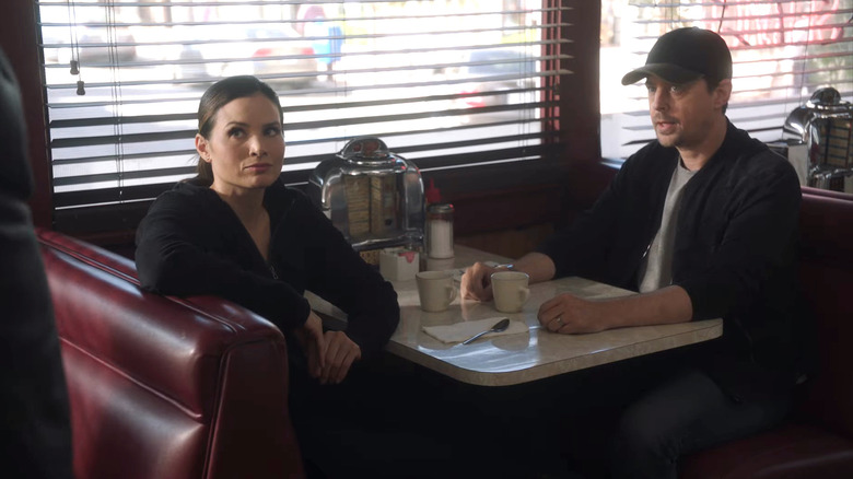 Jessica and McGee sitting in a booth together