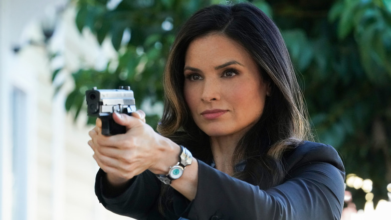 Agent Jessica Knight holding a gun