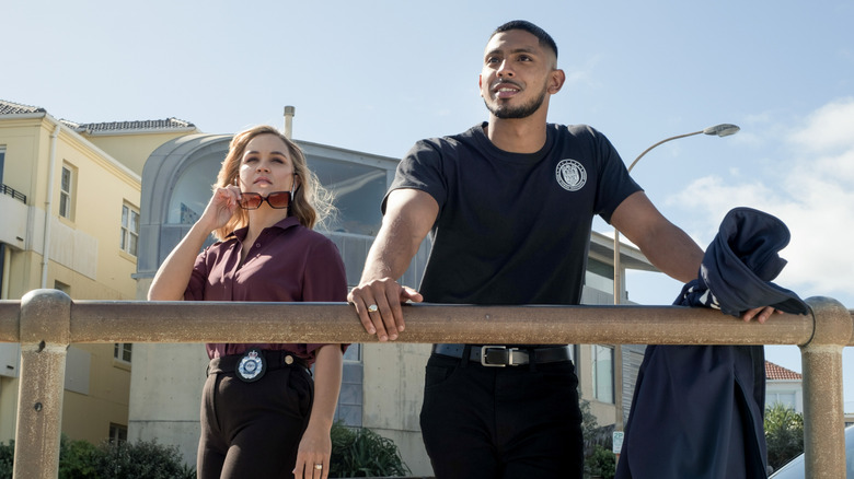 Evie Cooper and DeShawn Jackson standing by railing