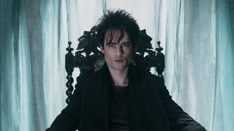 Tom Sturridge as Dream looking menacing as he sits on his throne