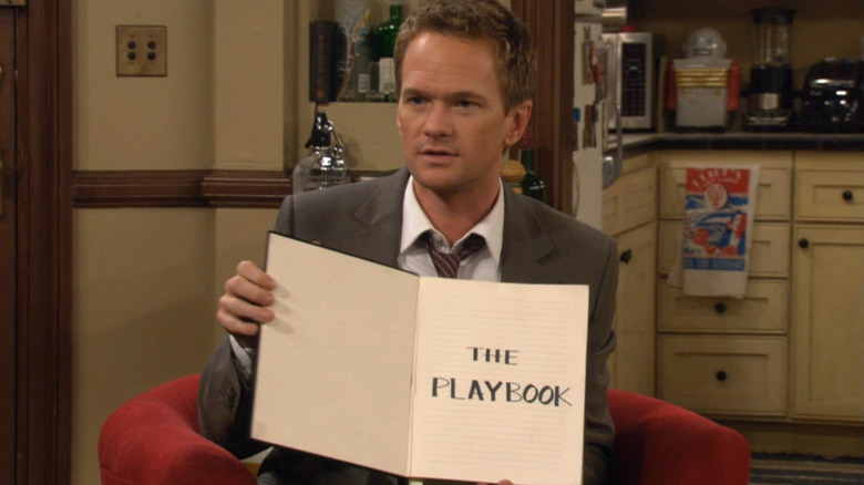 Barney Stinson showing "The Playbook."