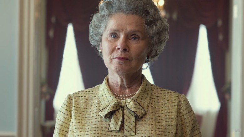 Queen Elizabeth II looks unimpressed with a member of her staff