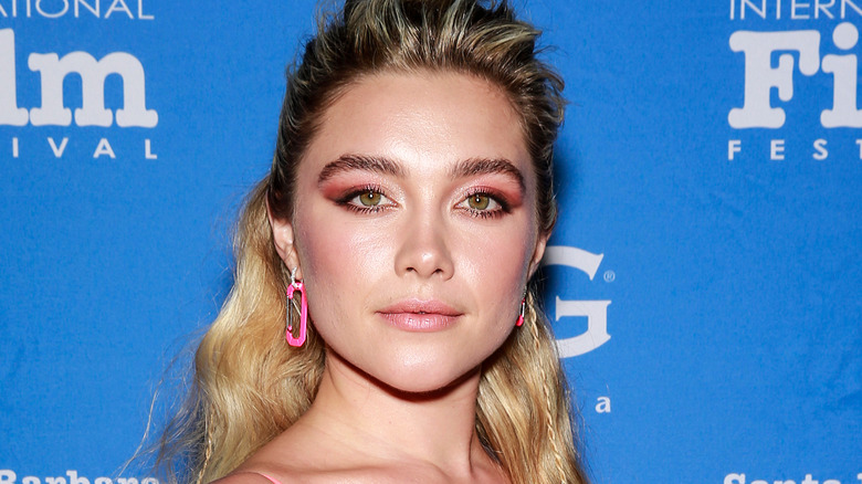 Florence Pugh wearing pink earrings