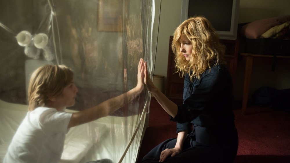 Charlie Shotwell as Eli Miller and Kelly Reilly as Rose Miller in Eli