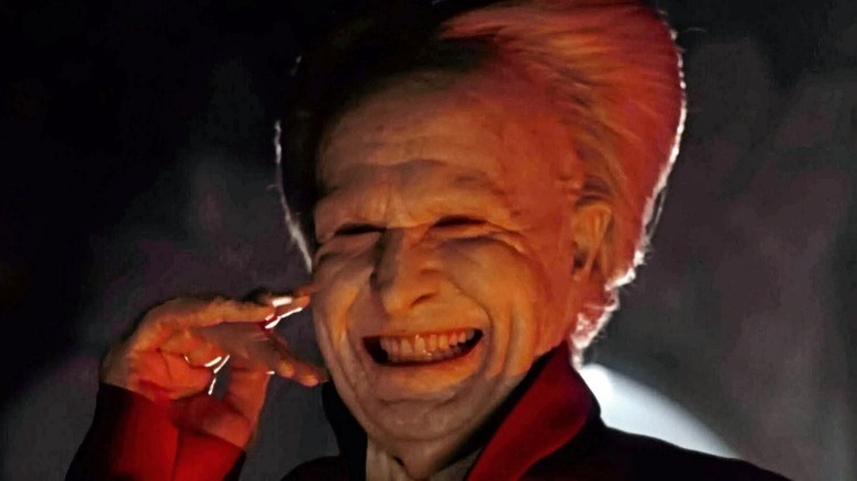 Dracula grinning white hair