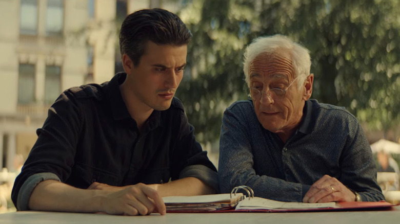 Matthias and his father looking through old paperwork