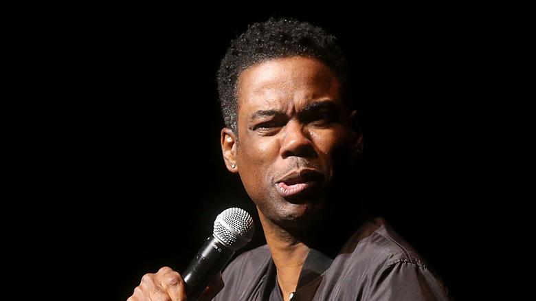 Chris Rock on stage with microphone