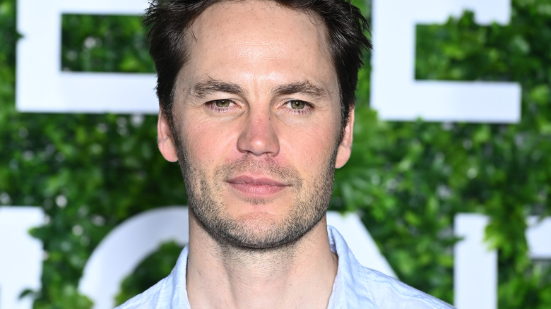 Taylor Kitsch  looks distracted