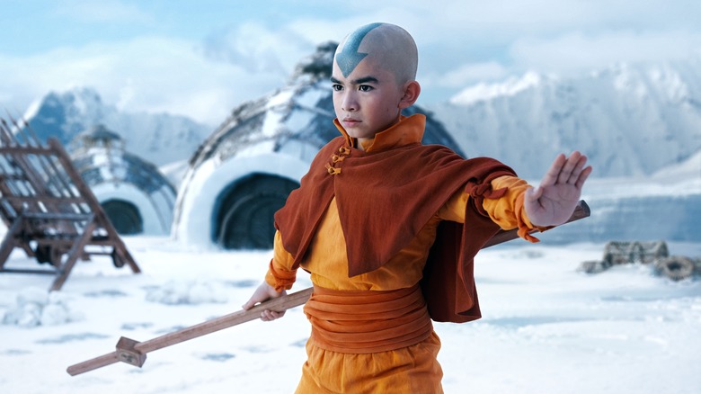 Aang brandishes his staff