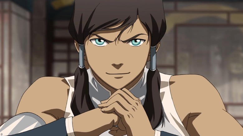 Smirking Korra cracking knuckles