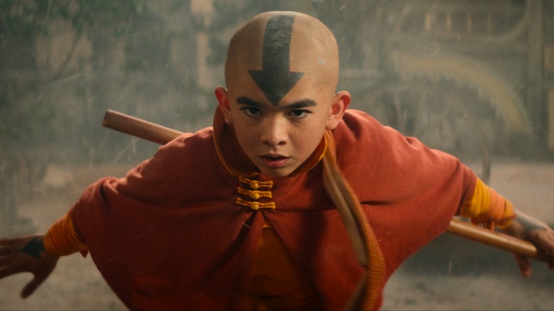 Aang clearing smoke with airbending