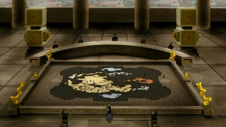 Katara observes a map of the Avatar World