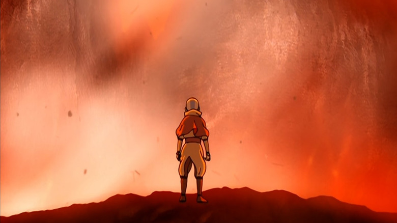 Aang standing before a volcano