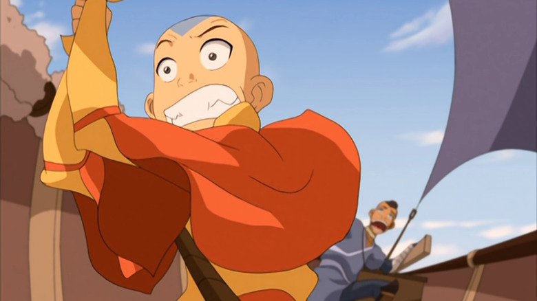 Sokka and Aang piloting a boat