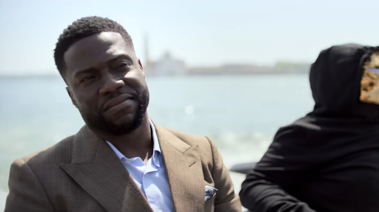 Kevin Hart sitting in front of ocean