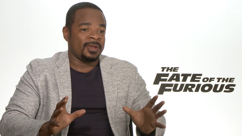 F. Gary Gray holds up hands 