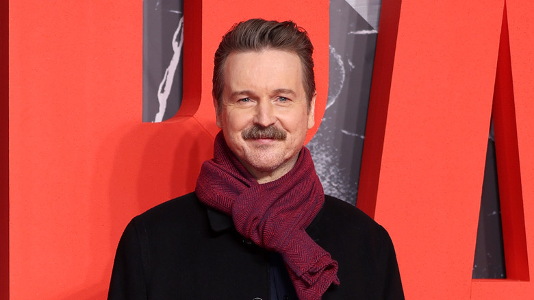 Matt Reeves with red scarf