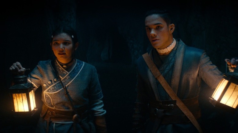 Katara and Sokka holding lanterns