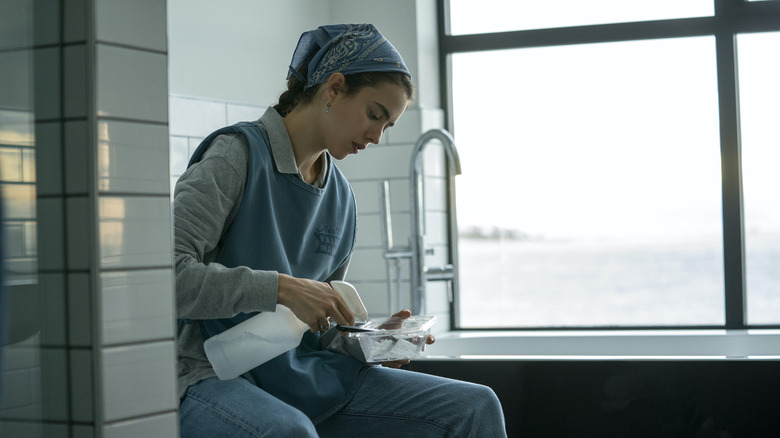 Alex cleans a bathroom in Maid