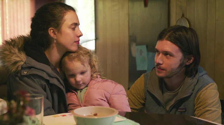 Alex, Maddy, and Sean sit in the trailer in Maid