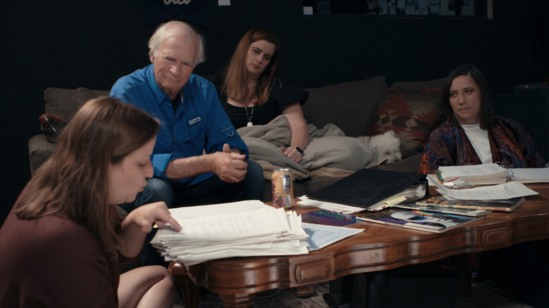 People looking through documents