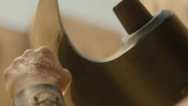 hand next to axe