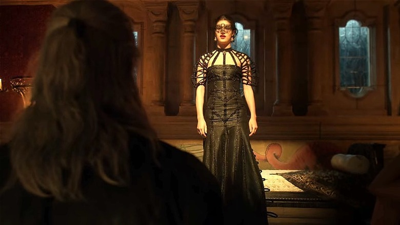 Yennefer on platform in puff-cage sleeve dress