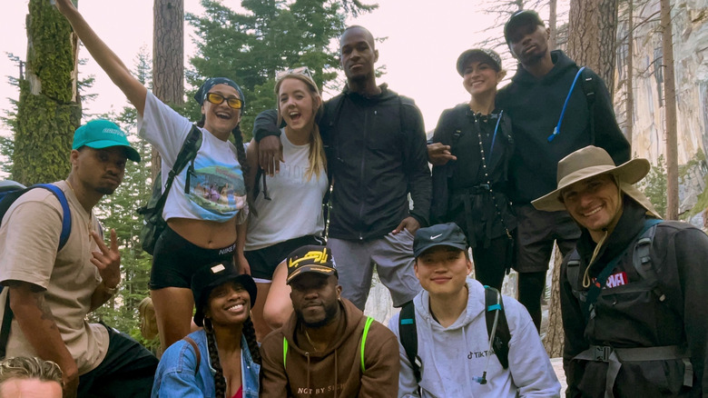 Young people smiling in forest