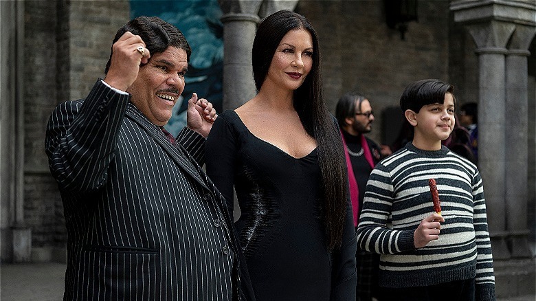 Gomez, Morticia, and Pugsley Addams smiling