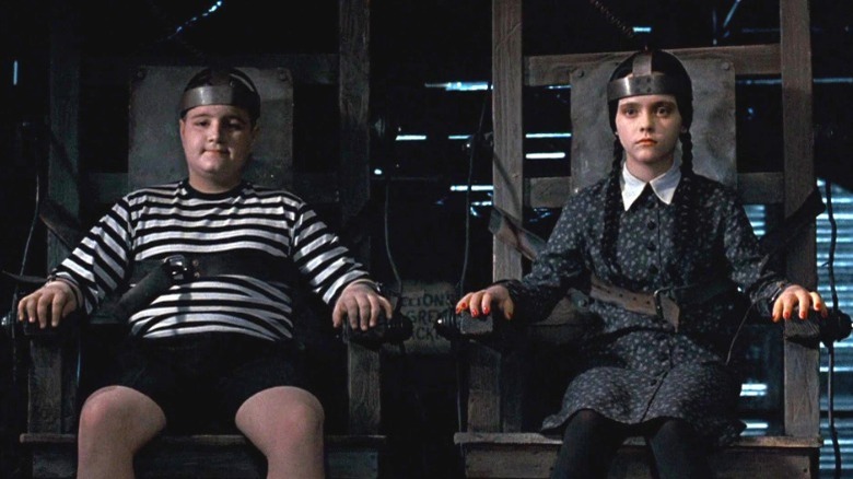 Wednesday and Pugsley in electric chairs