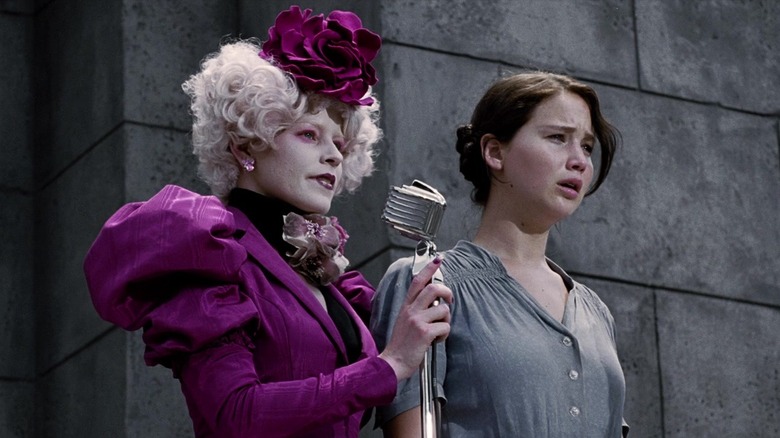 Effie Trinket standing with Katniss