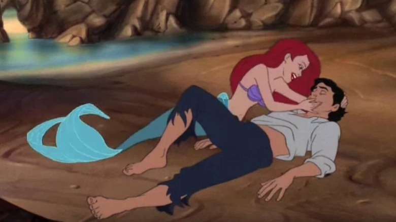 The Little Mermaid beach scene Ariel holding Prince Eric