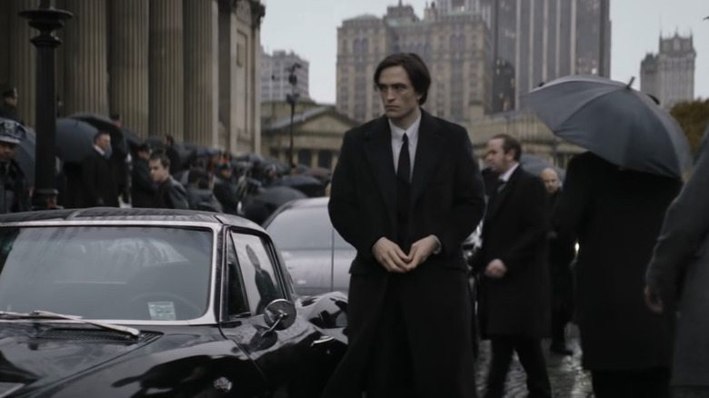 Bruce Wayne visits a funeral