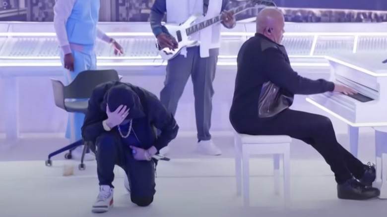 Eminem kneeling during his performance at the Super Bowl