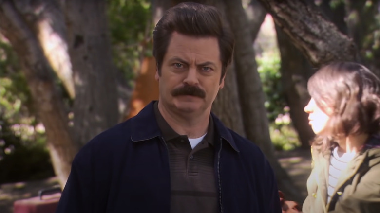 Ron Swanson standing in the woods