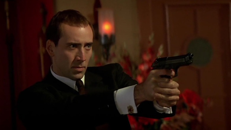 Nicolas Cage pointing gun in Face/Off