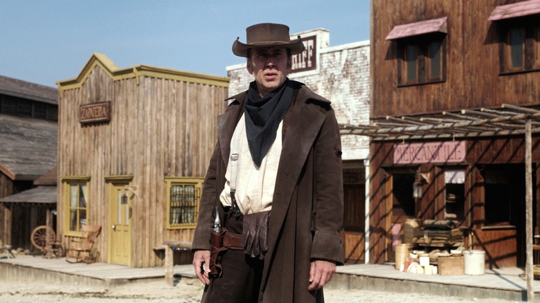 Nicolas Cage standing in town in "The Old Way"