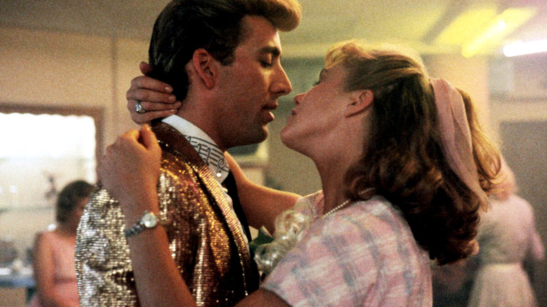 Nicolas Cage and Kathleen Turner kissing