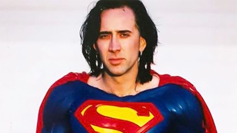 Nicolas Cage posing in Superman suit