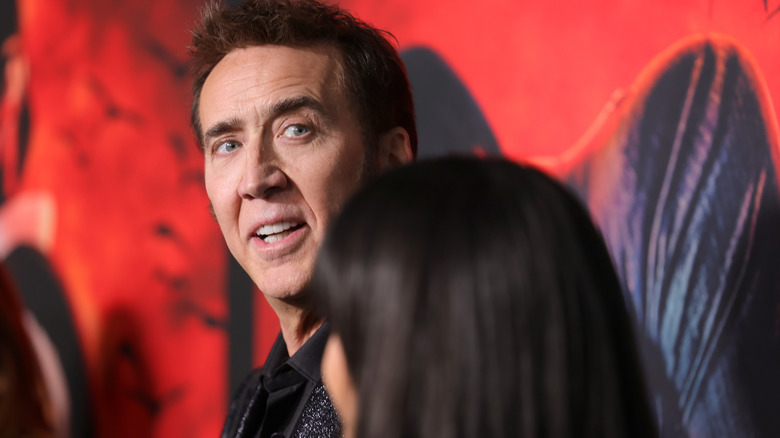 Nicolas Cage looks over his shoulder