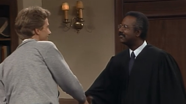 Judge Willard shaking hands with Harry