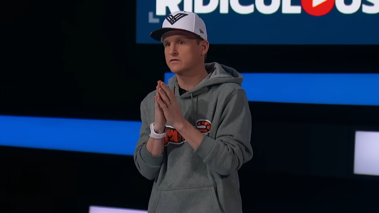 Rob Dyrdek looks away from camera