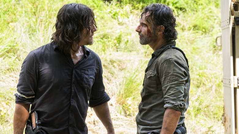 Daryl and Rick stare down