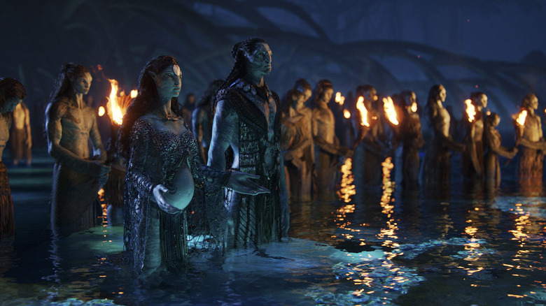 The Metkayina clan stand in the water